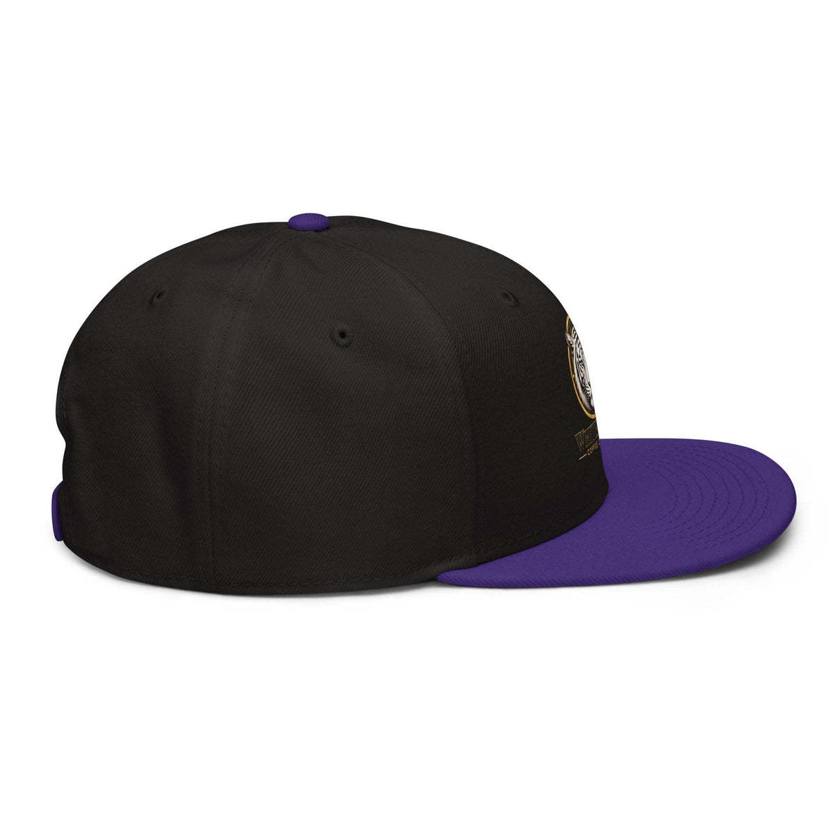 Snapback Hat in black structured fabric with a contrasting purple flat brim and top button, plus a small side patch.