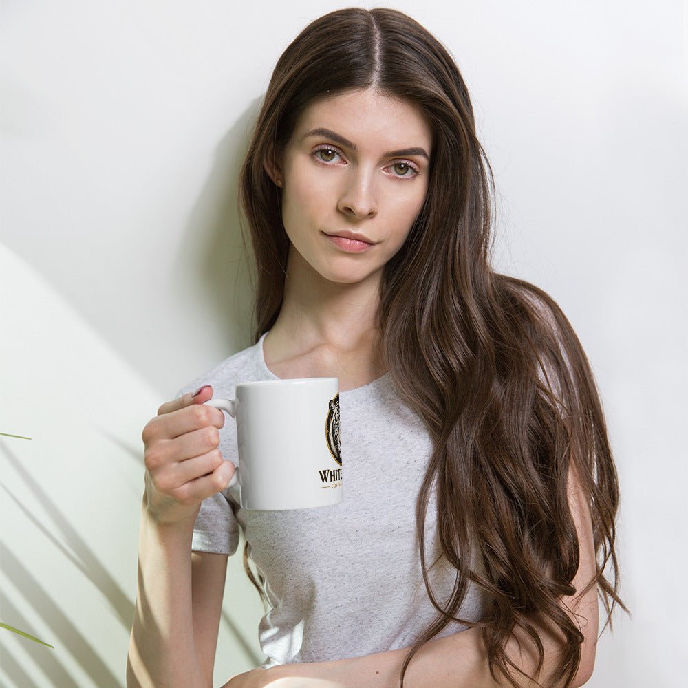 White Glossy Mug, ceramic with a smooth white finish and a small black-and-gold printed design on the side.